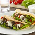 Warm lamb patties pittas with tzatziki & roasted red peppers