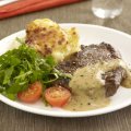 Steak with brandy & peppercorn sauce