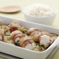 Baked monkfish wrapped in bacon with Thai green curry sauce