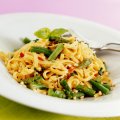 Asparagus fettucine stir fry with peanut sauce