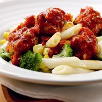 Roasted saucy meatballs with veggie pasta