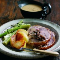 Glazed roast saddle of lamb with barley & plum stuffing