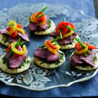 Lamb blinis with marinated peppers & herb relish