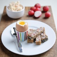 Radish butter on rye toast with soft-boiled eggs