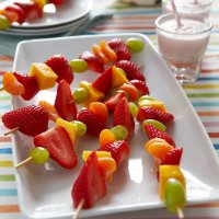 Fruit kebabs with strawberry milk
