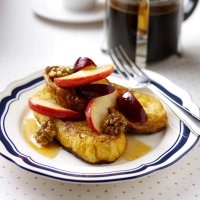 Pain perdu with caramelised apple wedges, plums & walnuts